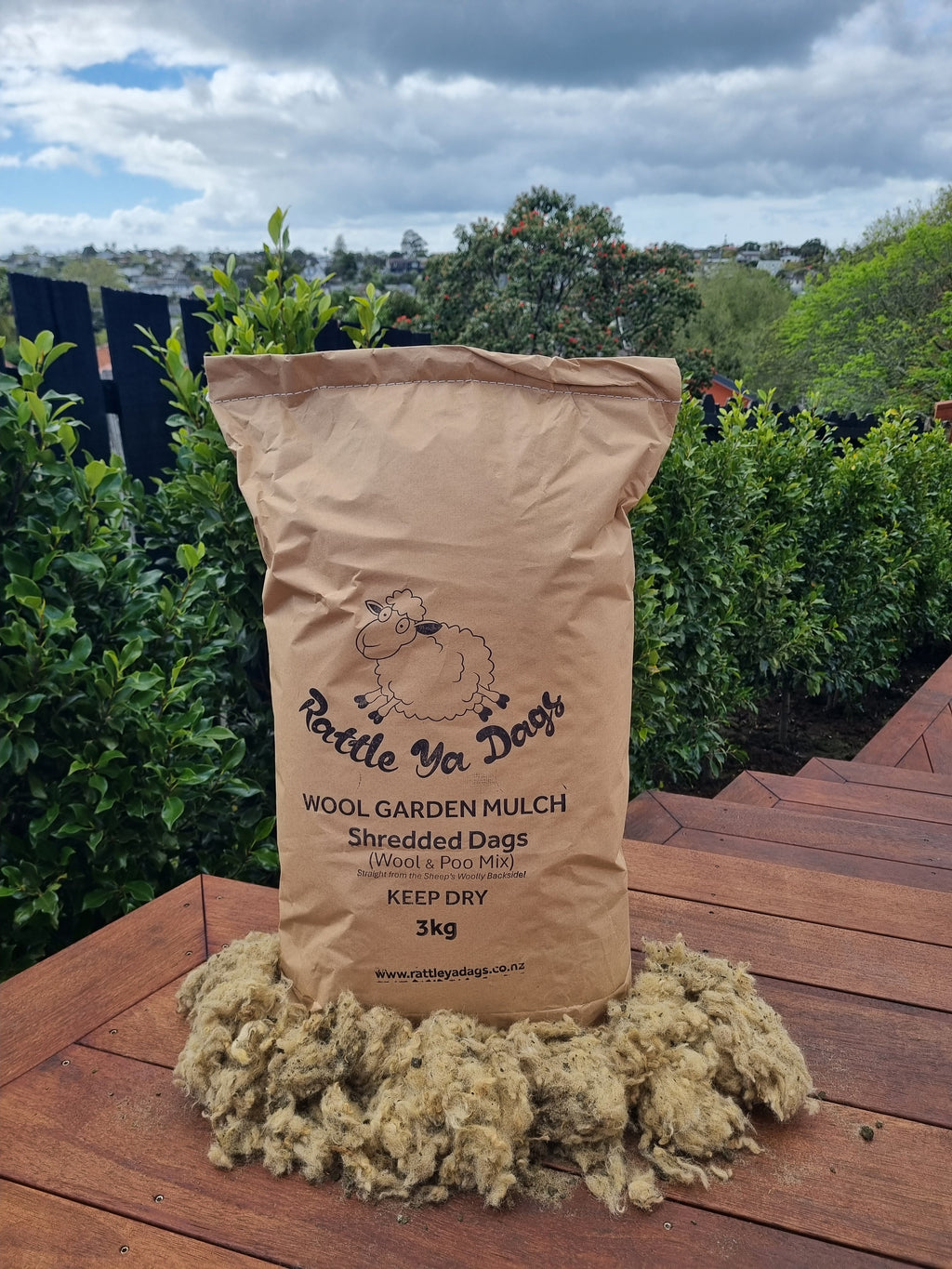 Retail bag of wool mulch used for moisture retention and weed suppression in gardens.